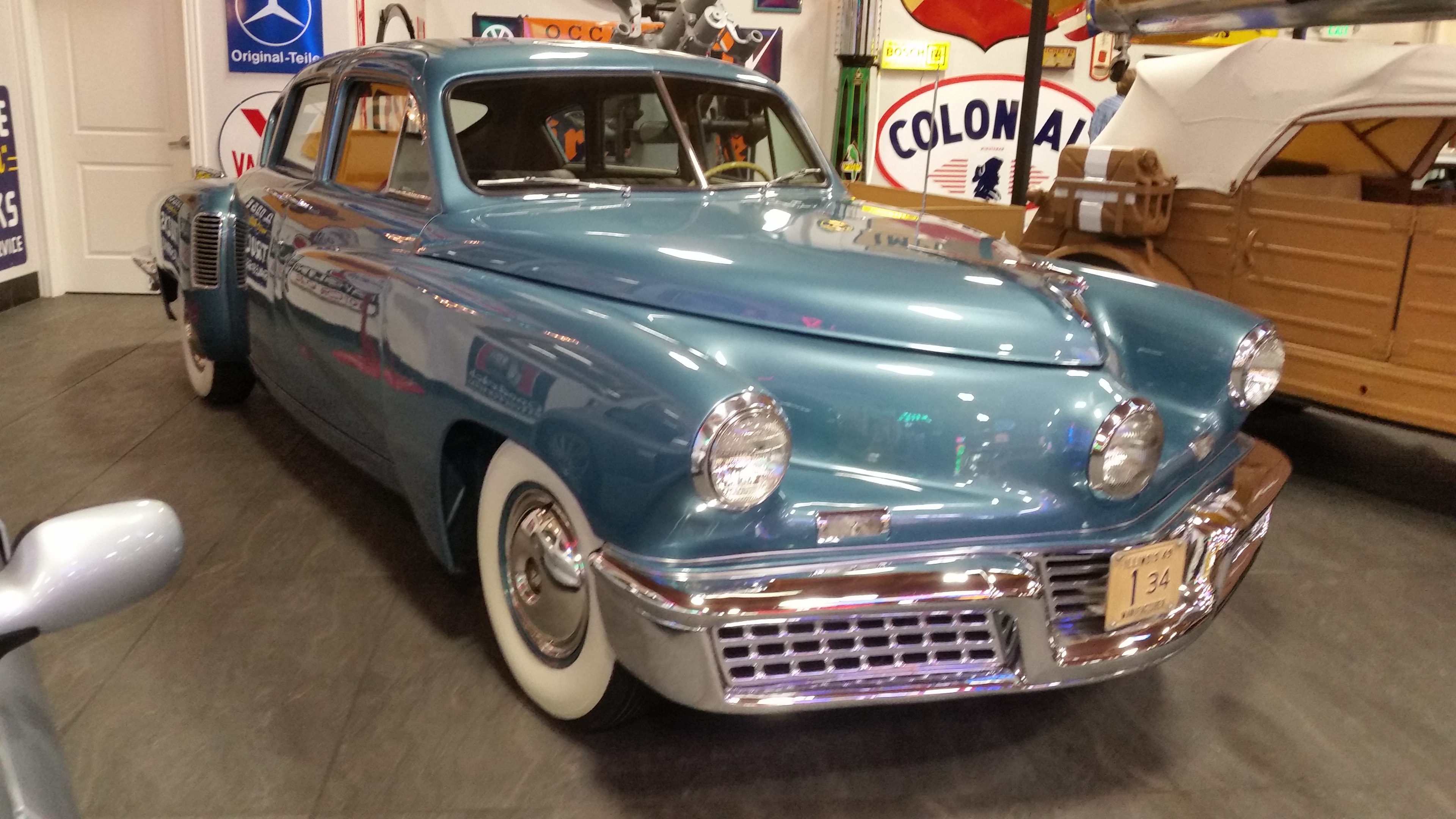 Vintage Tucker automobile in collector garage