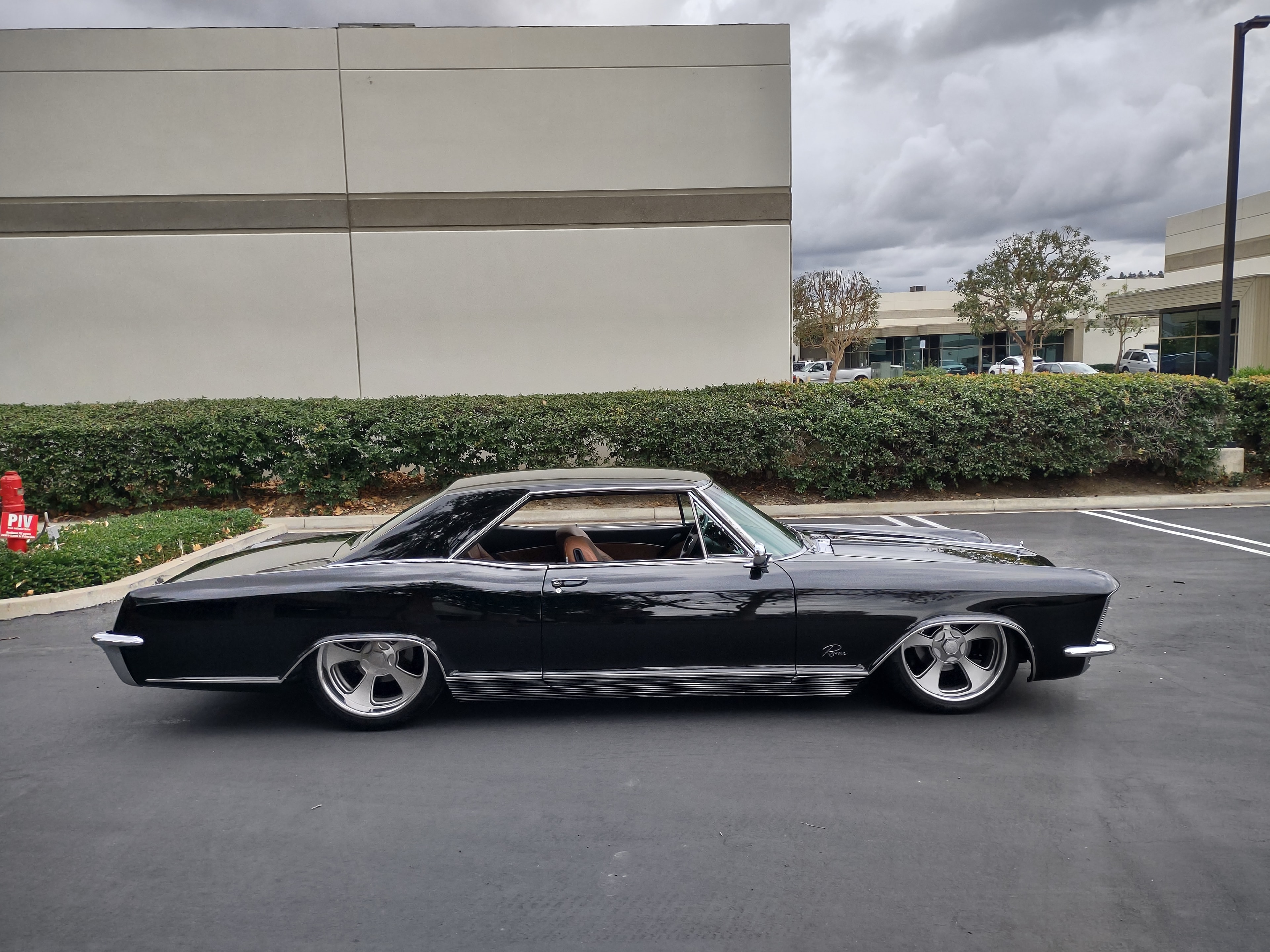 Custom Buick Riviera — slammed, blacked out, and absolutely menacing.