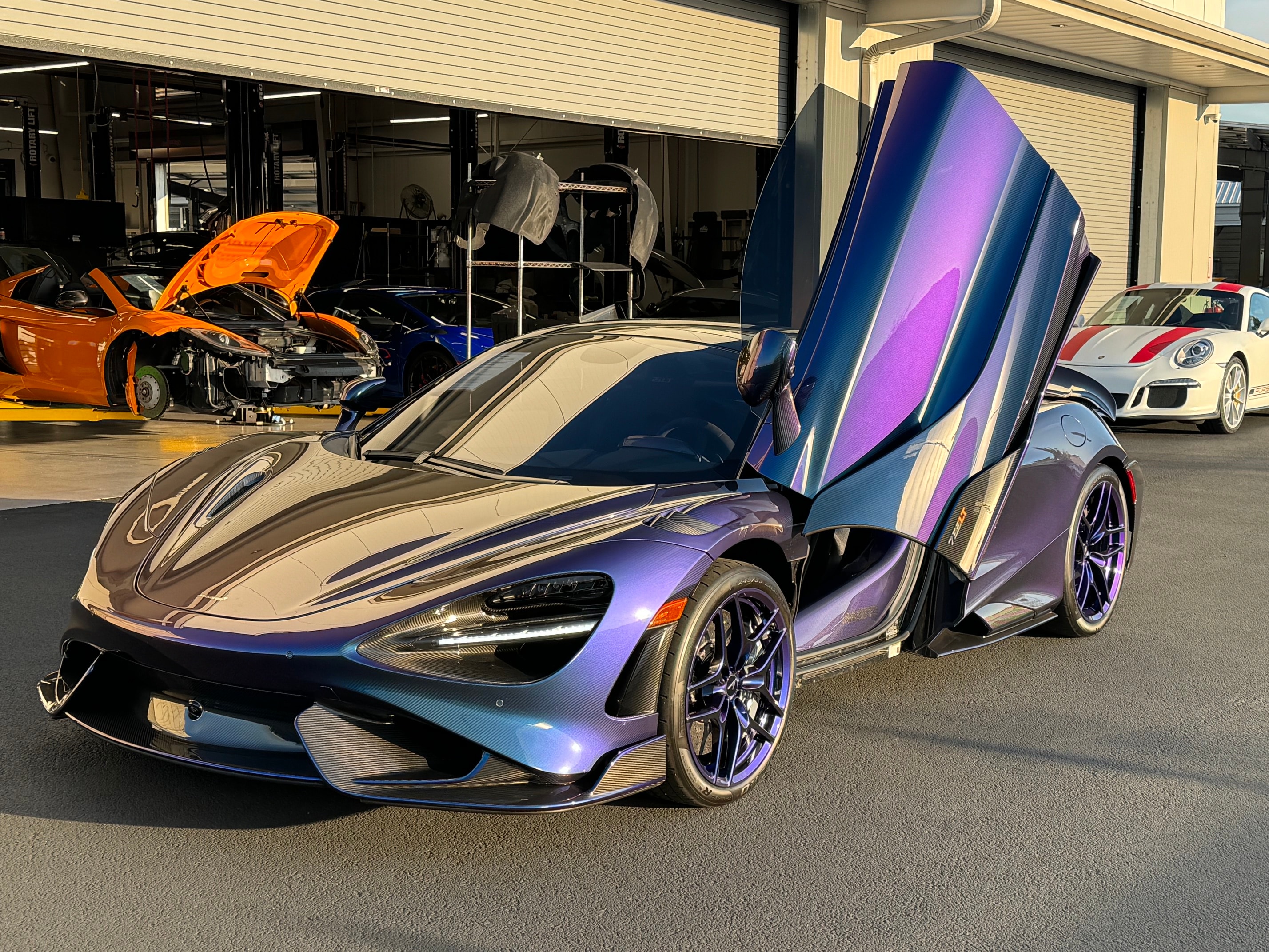 McLaren 765LT — full exposed carbon fiber body with an iridescent finish. One of one.